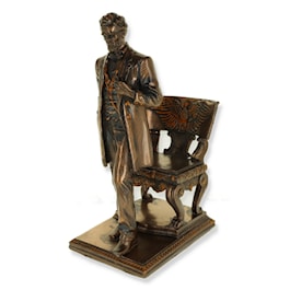Abraham Lincoln Standing Near Chair with Eagle Figurine