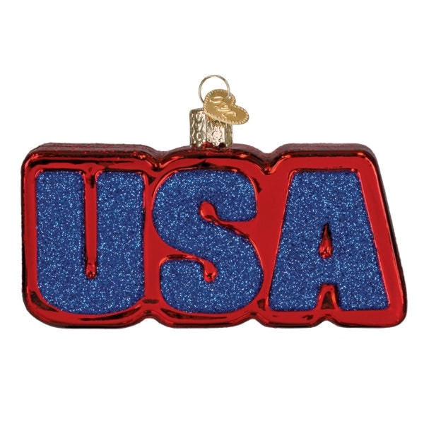 Old World Christmas USA lettering and flag glass ornament on a white background